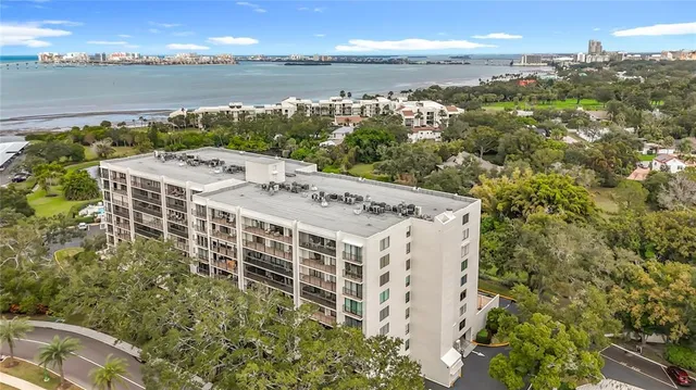 a view of a building with lake view and mountain view