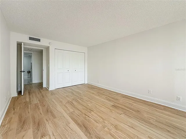 a bathroom with a double vanity sink a mirror and a shower