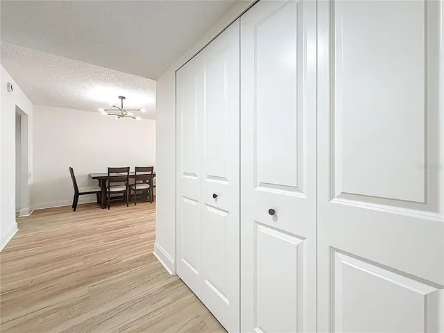 a view of a livingroom with chairs and wooden floor
