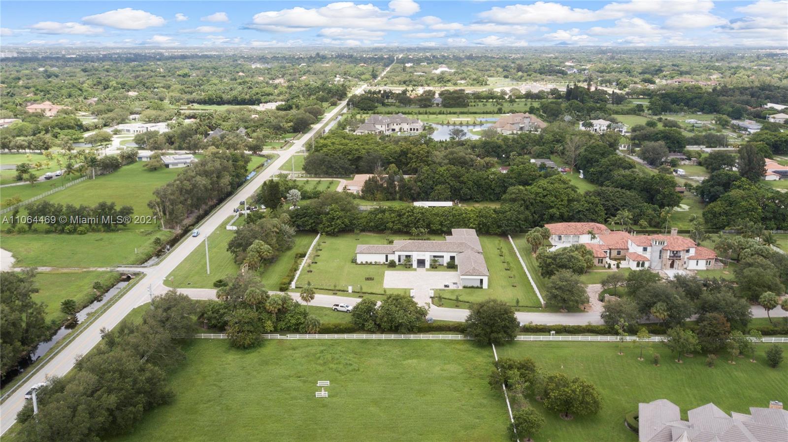 12701 Stirling Road Southwest Ranches, FL 33330 - Photo 36 of 38 an aerial view of residential houses with outdoor space and swimming pool