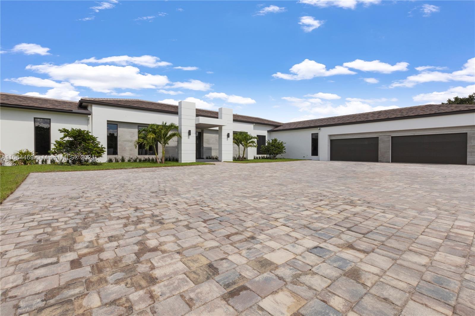 12701 Stirling Road Southwest Ranches, FL 33330 - Photo 7 of 38 a view of a house with a yard