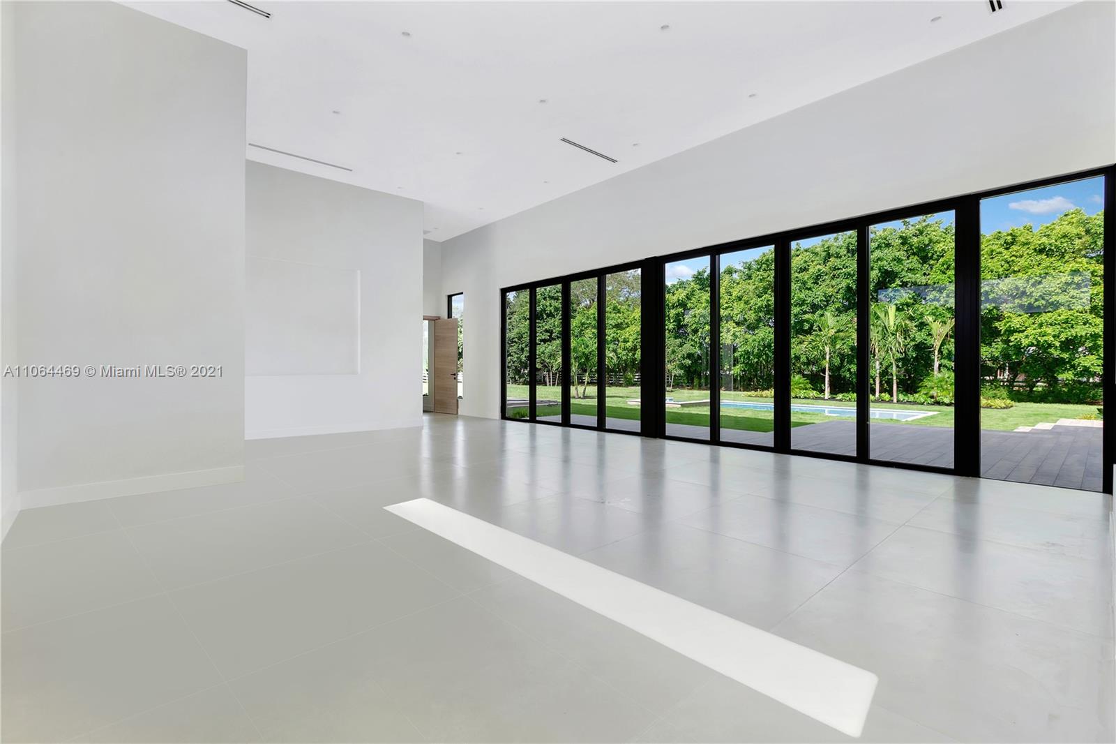 12701 Stirling Road Southwest Ranches, FL 33330 - Photo 9 of 38 a view of an empty room with a large window