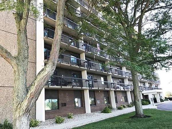 front view of a building with a yard