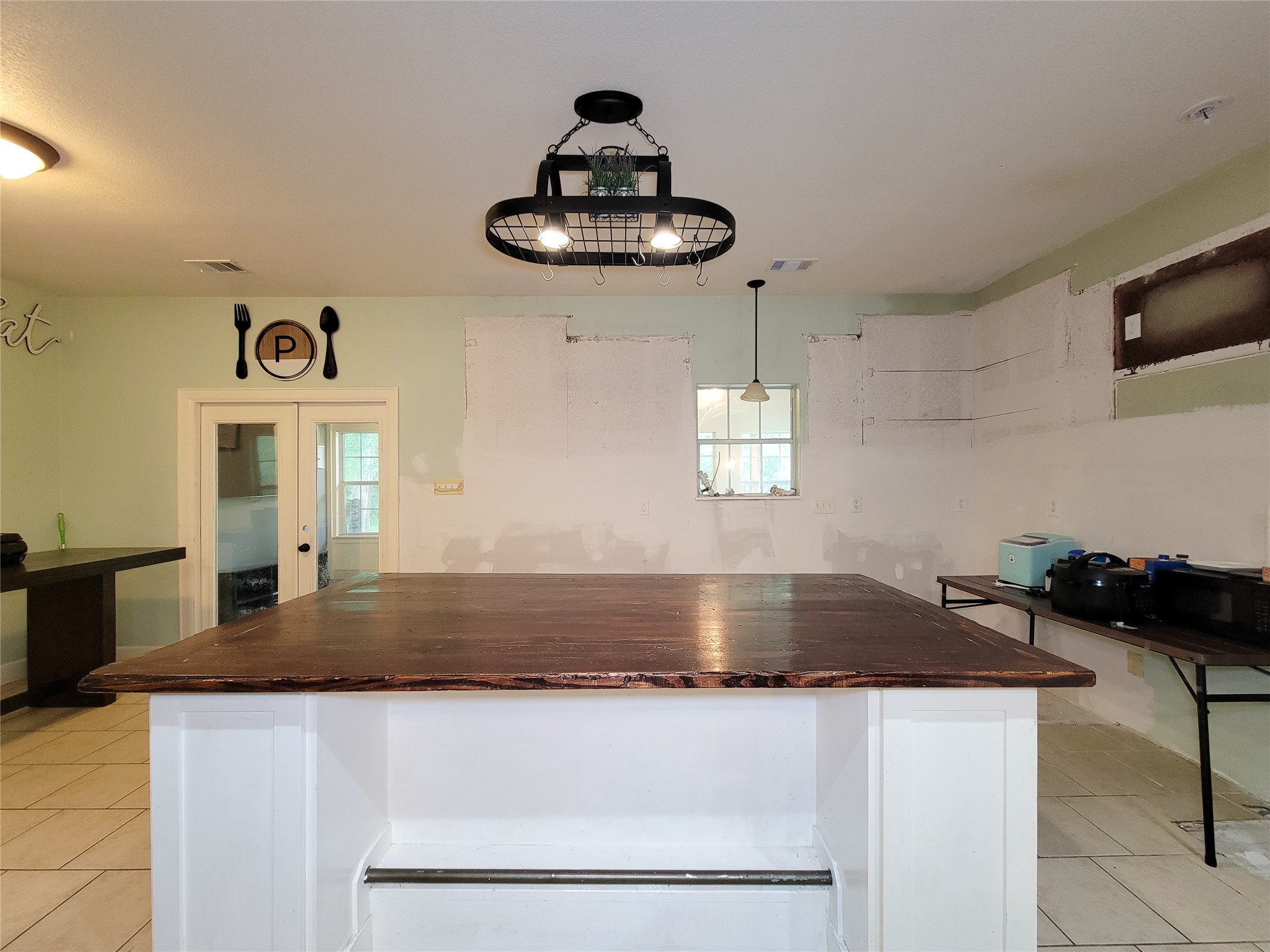 2011 Old Ox Road Spring, TX 77386 - Photo 20 of 38 a kitchen with kitchen island granite countertop stainless steel appliances a sink and a stove