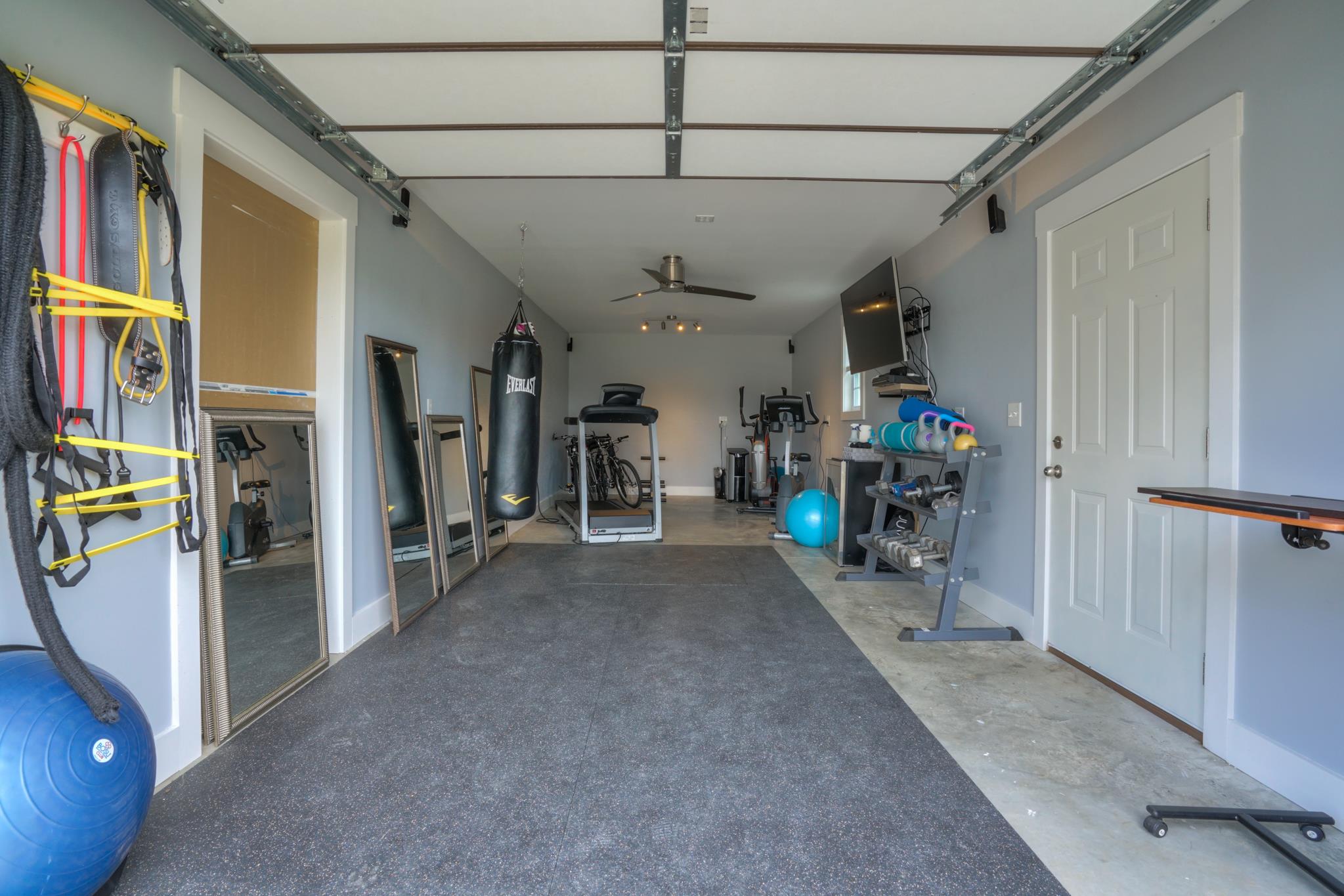 5051 Epps Mill Road Christiana, TN 37037 - Photo 19 of 26 One bay of detached garage is cooled and wired for cable & electricity. Used as exercise studio. (TV mount stays, Exercise equipment does not stay.)