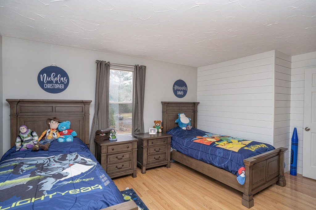 113 Pierce Street Rochester, MA 02770 - Photo 16 of 40 a bed room with furniture and a fireplace