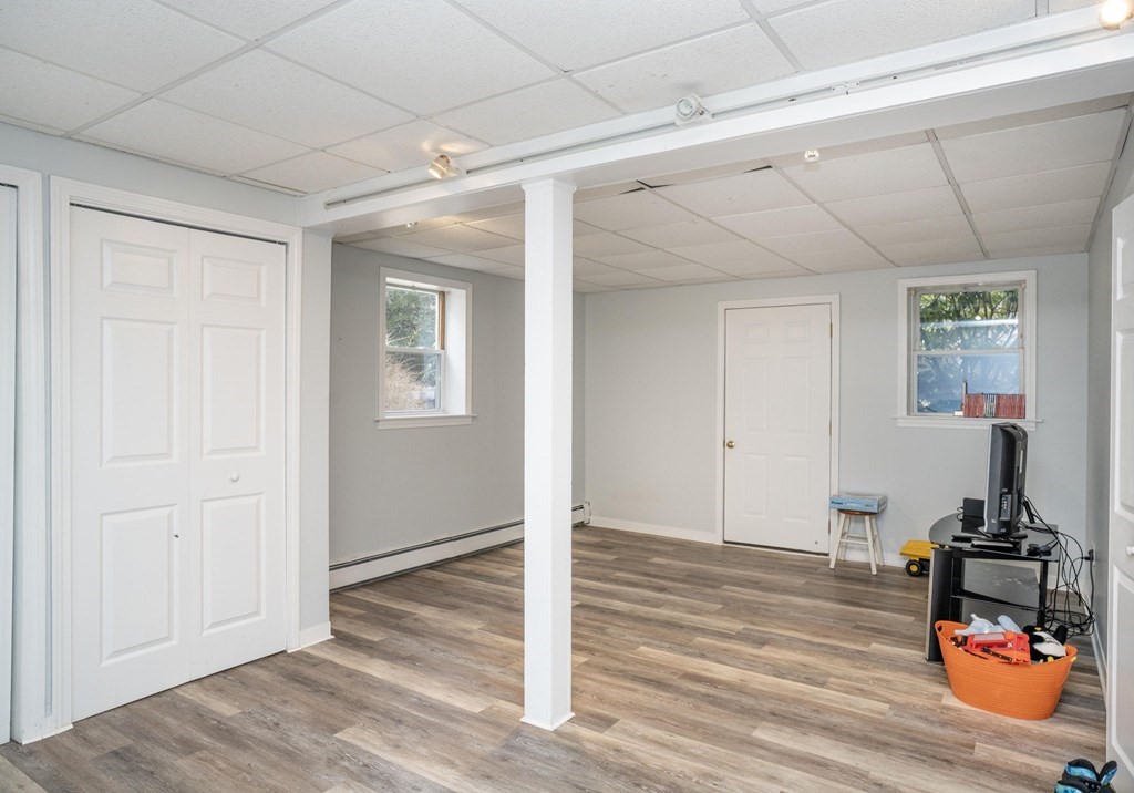 113 Pierce Street Rochester, MA 02770 - Photo 27 of 40 a room with wooden floor and gym equipment
