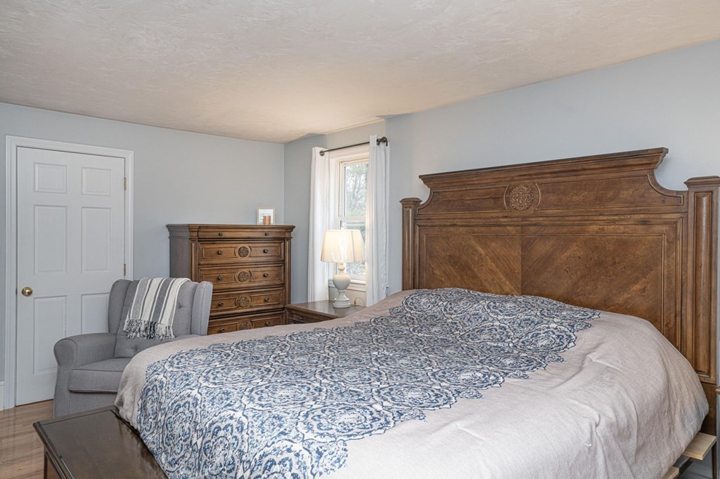 113 Pierce Street Rochester, MA 02770 - Photo 33 of 40 a bedroom with a bed and furniture