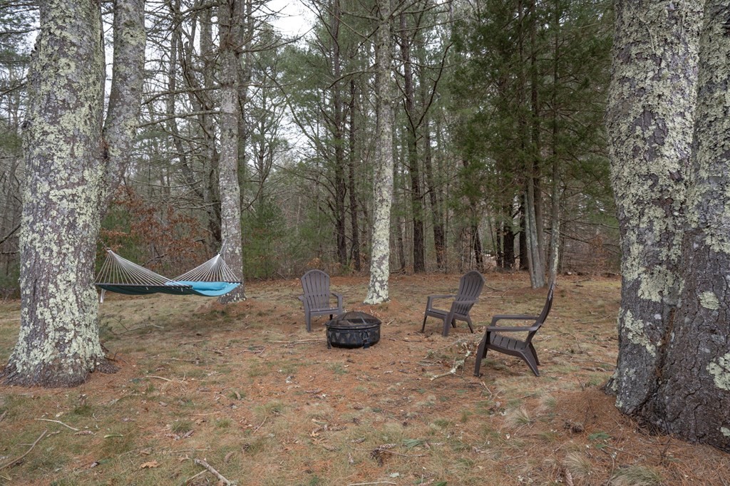 113 Pierce Street Rochester, MA 02770 - Photo 5 of 40 a backyard of a house with table and chairs