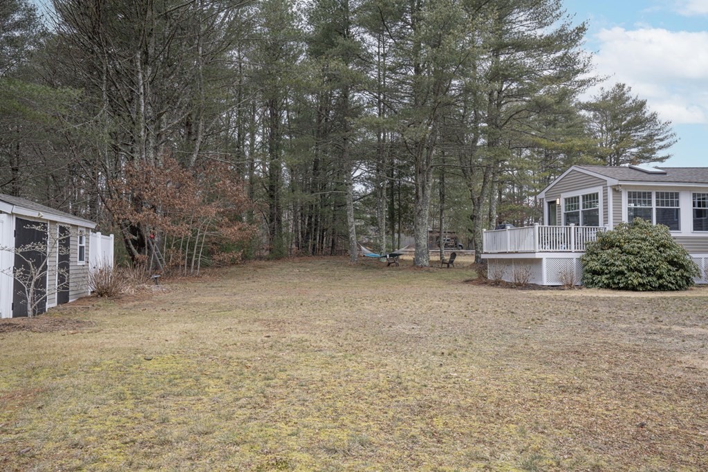113 Pierce Street Rochester, MA 02770 - Photo 7 of 40 a view of backyard of house with green space