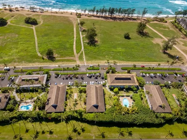 an aerial view of a residential building with outdoor space