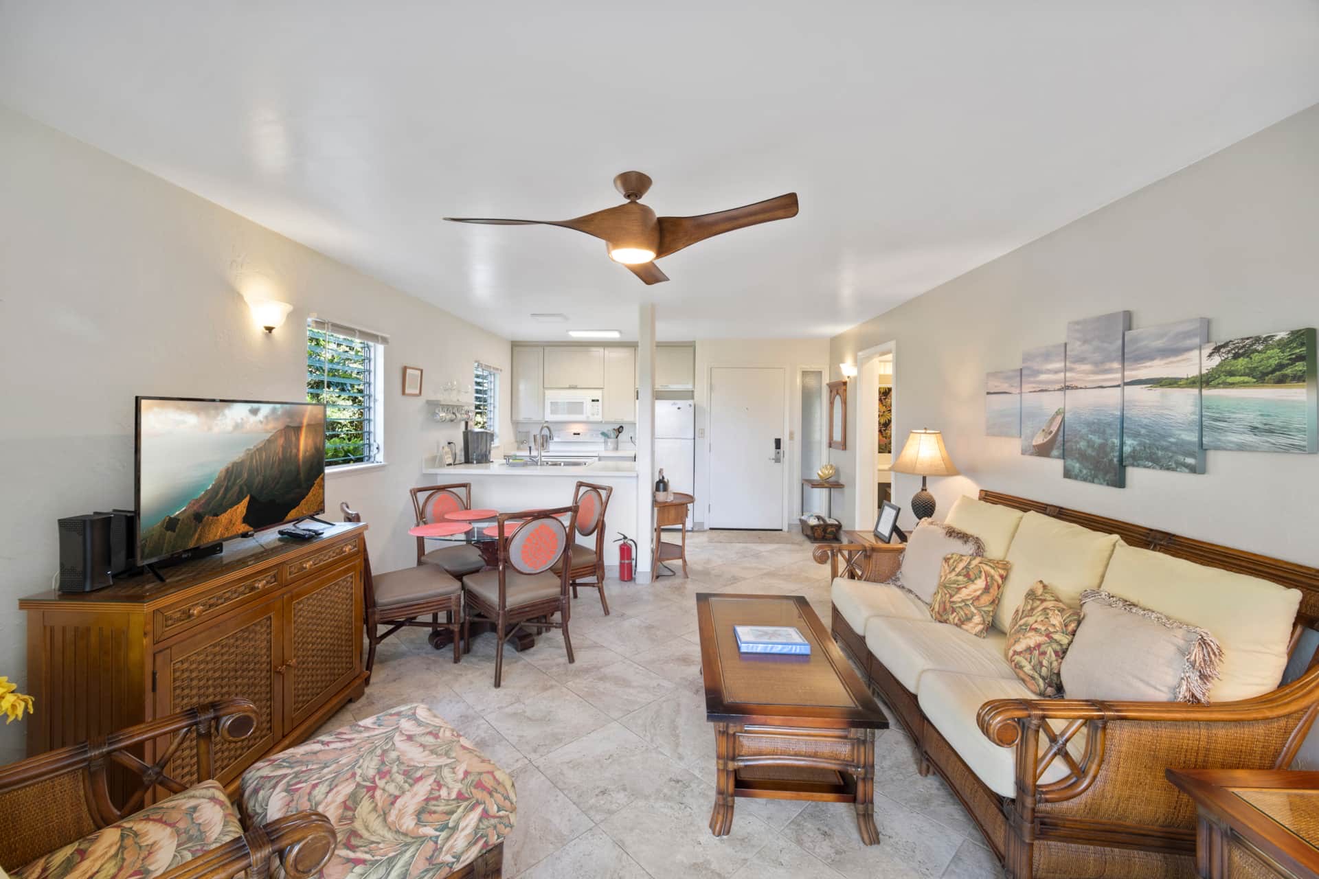 525 Aleka Loop, Unit K8 Kapaa, HI 96746 - Photo 6 of 13 a living room with furniture and a flat screen tv