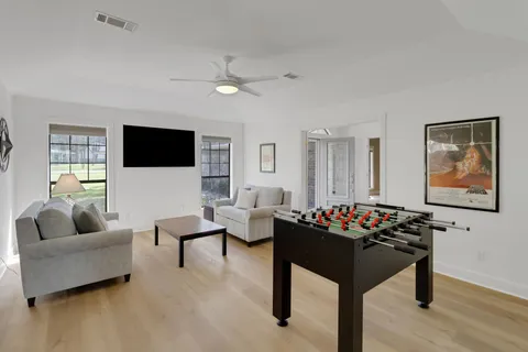 a room with furniture and wooden floor