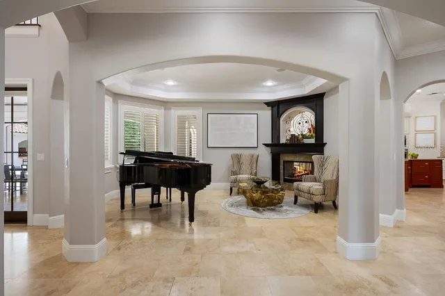 a living room with fireplace furniture and a flat screen tv