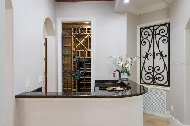 a bathroom with a granite countertop sink vanity mirror and toilet