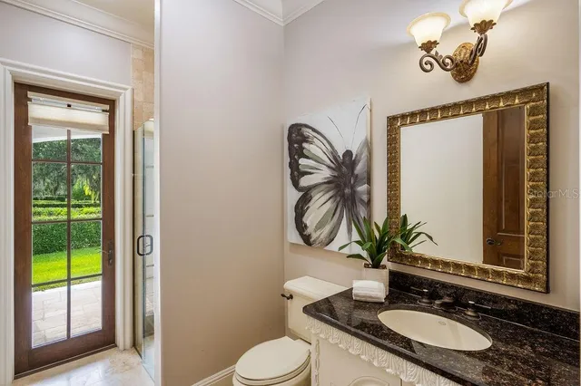 a front view of a building with a garden