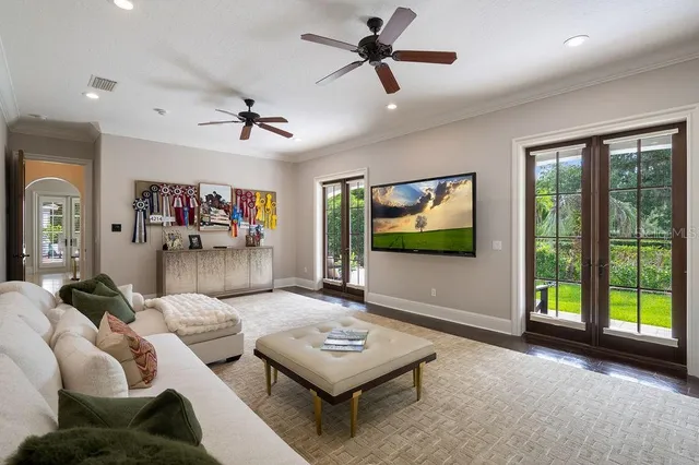a view of a house with swimming pool and sitting area