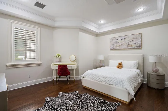 a front view of a house with a swimming pool