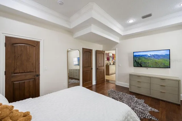 a view of a dining room with furniture wooden floor and chandelier