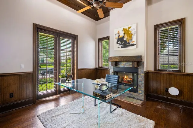 a view of a house with swimming pool and sitting area