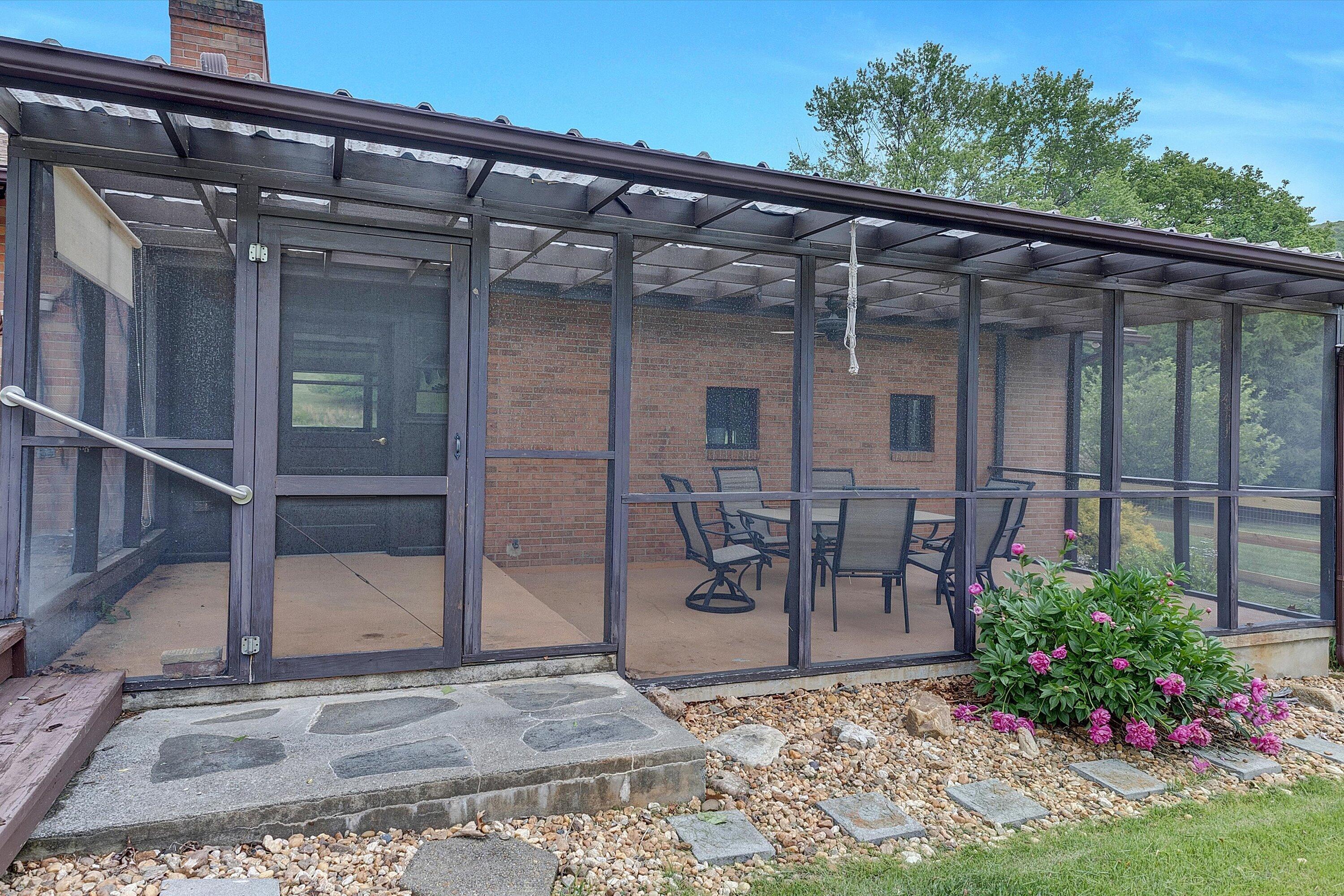 2015 Evergreen Road Covington, VA 24426 - Photo 31 of 46 a view of a patio with table and chairs and potted plants