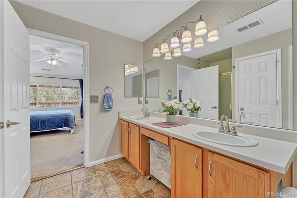 a bathroom with a sink double vanity and a mirror