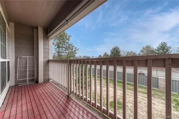 a view of balcony with wooden floor