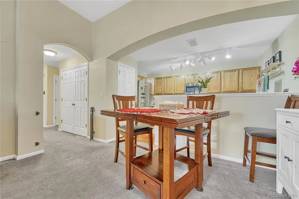 a room with a table and chairs