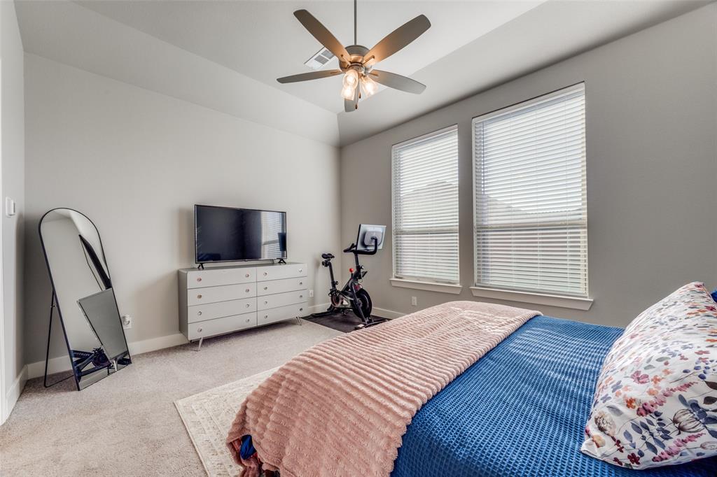 817 Markham Drive Anna, TX 75409 - Photo 12 of 27 a bedroom with bed tv and window