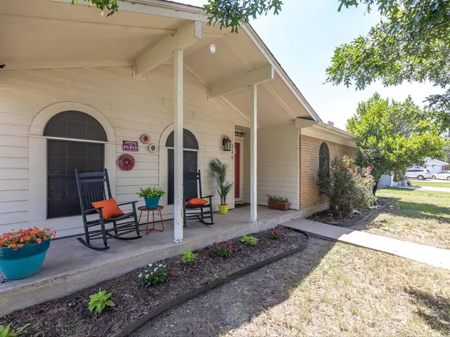 a front view of a house with outdoor seating