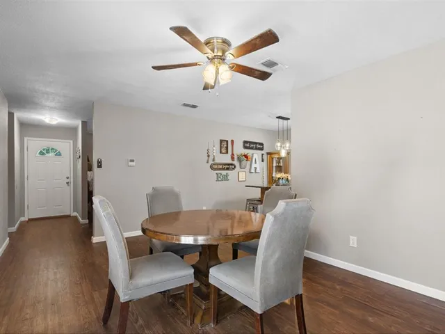 a dining room with furniture and window