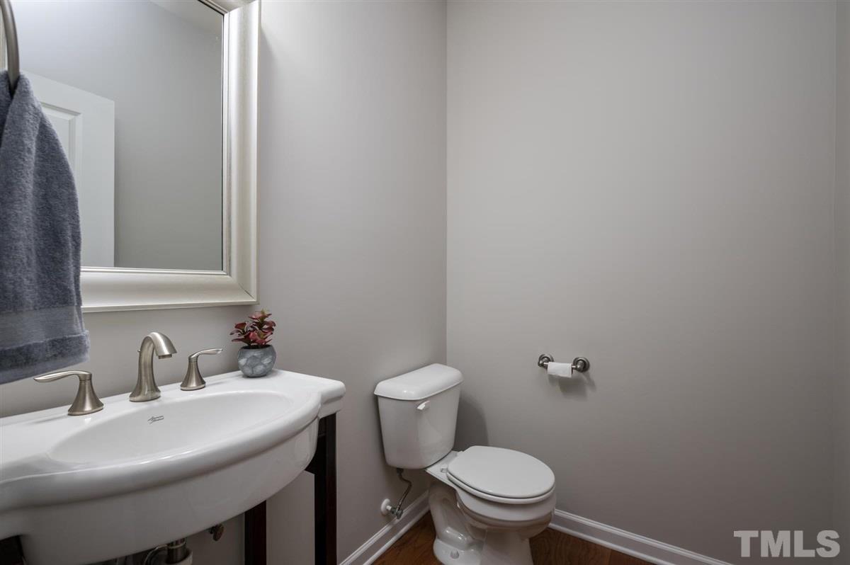 715 Edgewater Ridge Court Apex, NC 27523 - Photo 15 of 29 Spacious powder room, tucked away.
