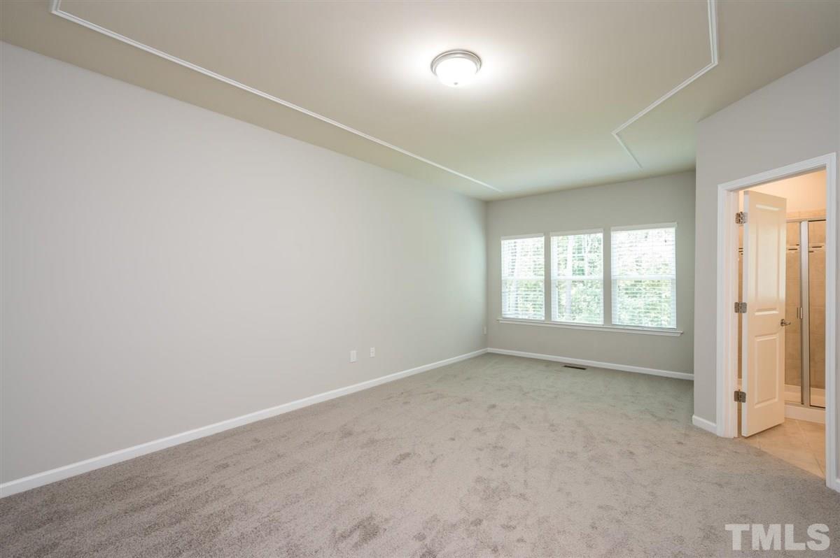 715 Edgewater Ridge Court Apex, NC 27523 - Photo 16 of 29 Incredible space in this master bedroom!