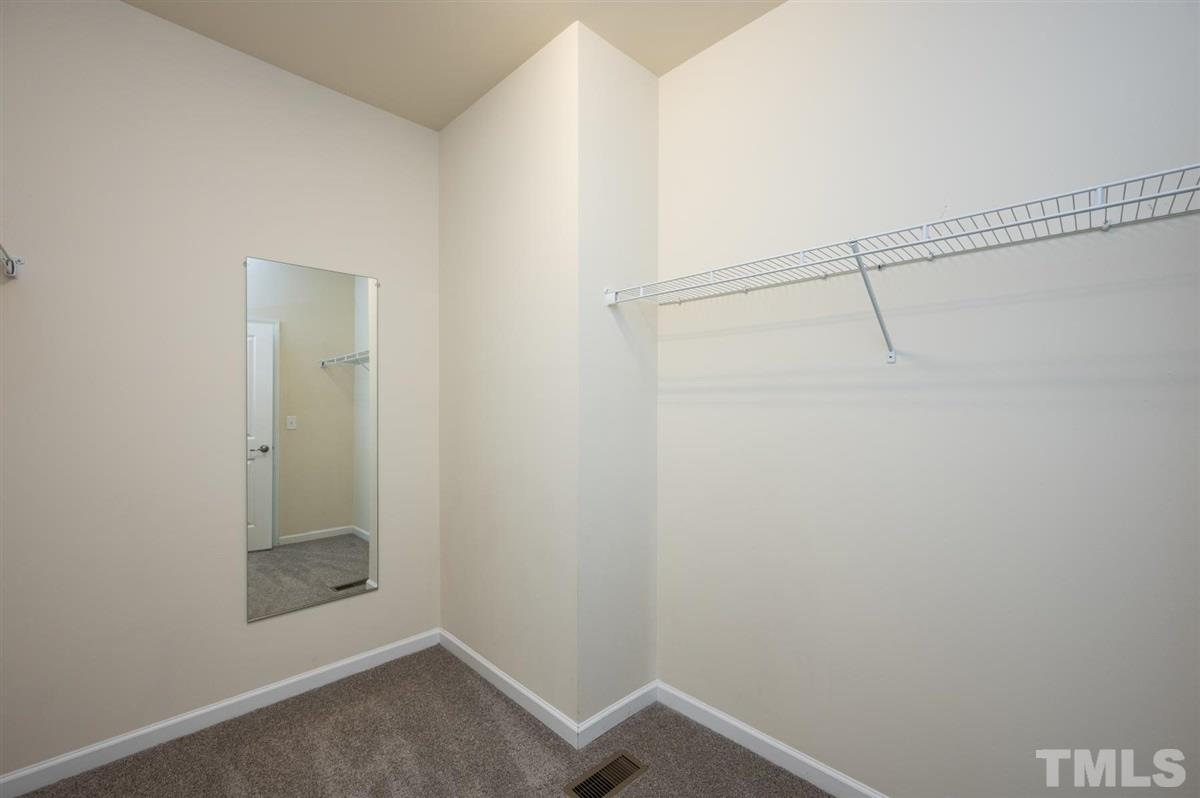 715 Edgewater Ridge Court Apex, NC 27523 - Photo 18 of 29 Another view of the master closet.