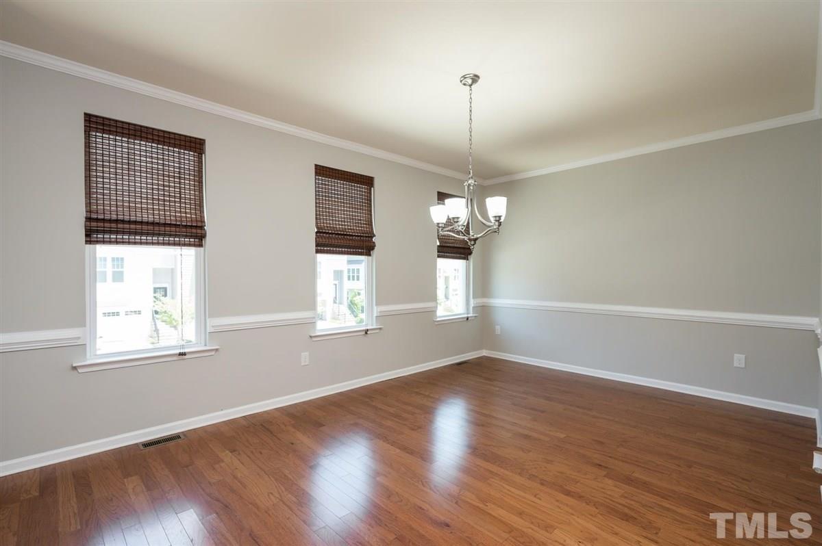 715 Edgewater Ridge Court Apex, NC 27523 - Photo 3 of 29 Up the stairs from the front door and this large, bright dining room awaits!