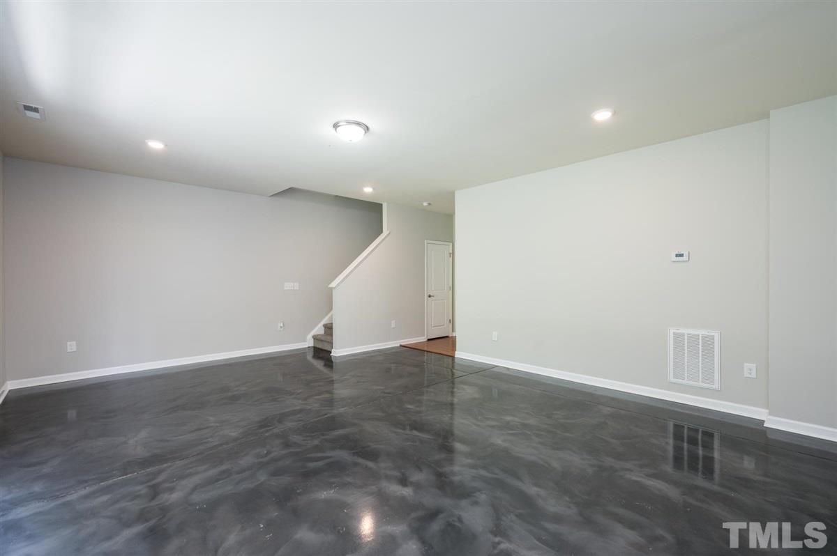 715 Edgewater Ridge Court Apex, NC 27523 - Photo 25 of 29 Another view of the bonus space. There is a closet in this room, as well as direct access to the garage.