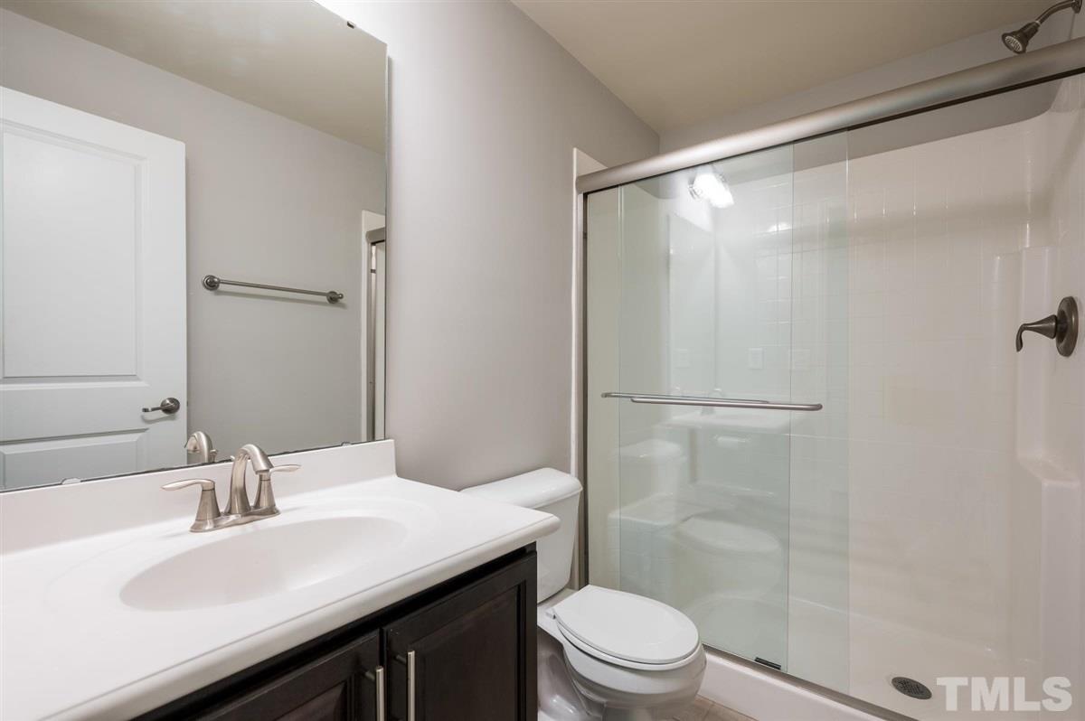 715 Edgewater Ridge Court Apex, NC 27523 - Photo 26 of 29 The ground floor FULL bathroom! Yes, that makes 3.5 bathrooms in this home!