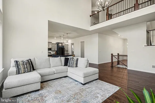 a living room with furniture and a rug
