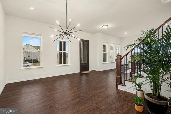 a view of an entryway with wooden floor