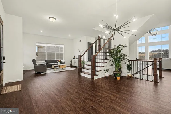 a view of a livingroom with furniture and a floor to ceiling window