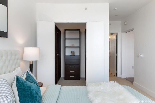 a living room with furniture and a lamp