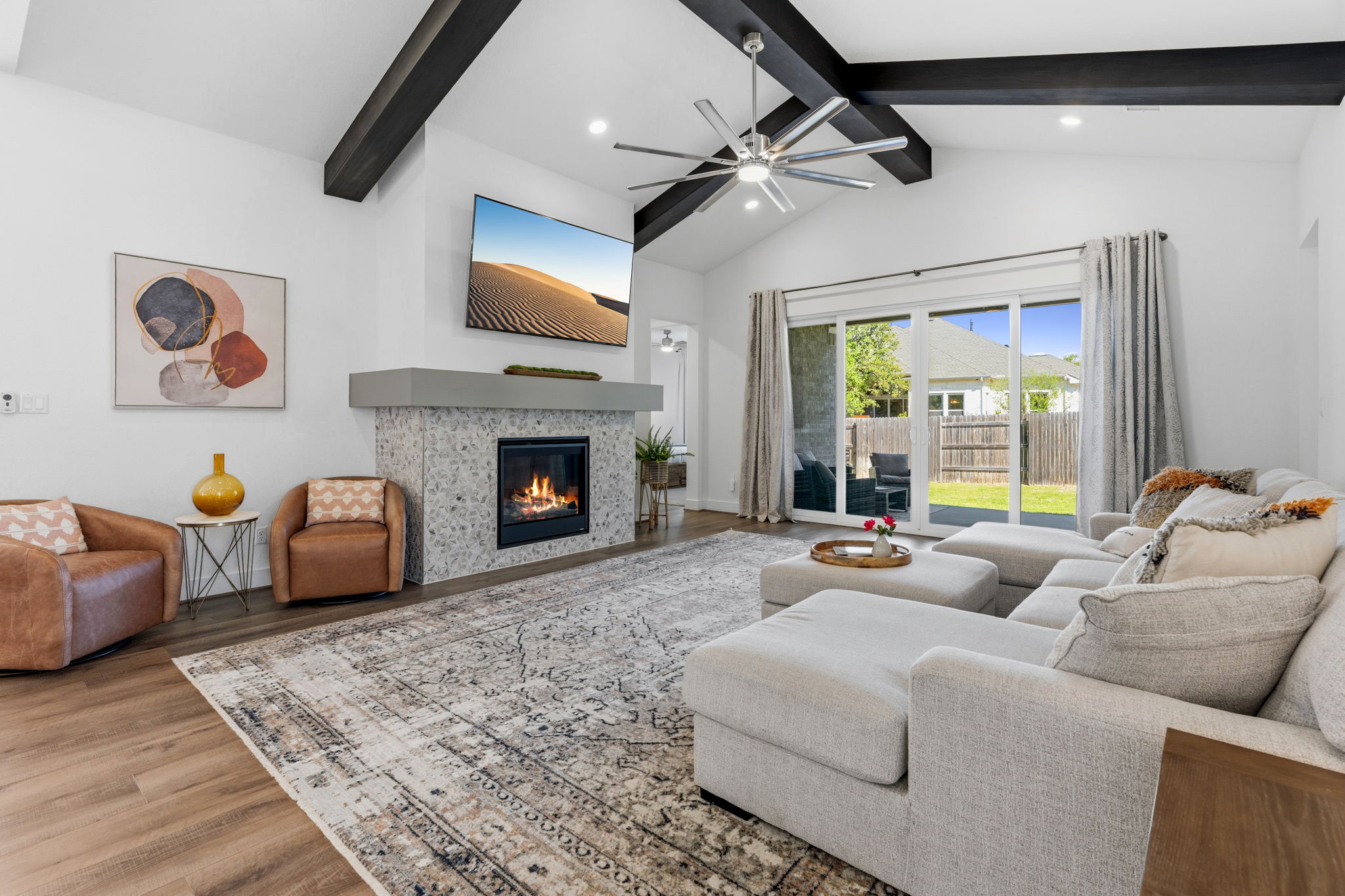 306 Bridge Water Loop Dripping Springs, TX 78620 - Photo 13 of 40 a living room with furniture and a fireplace