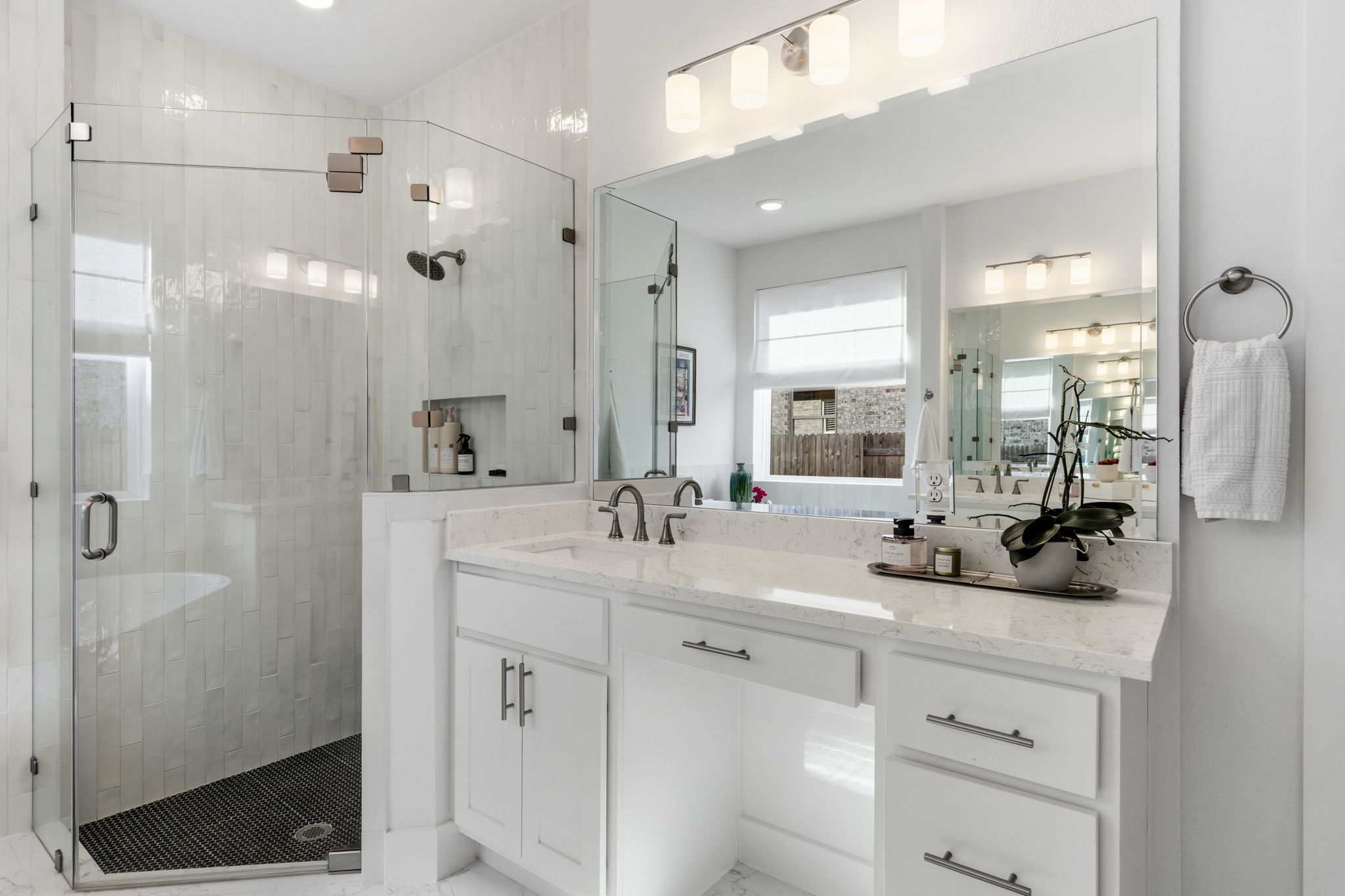 306 Bridge Water Loop Dripping Springs, TX 78620 - Photo 20 of 40 a bathroom with double sink and a mirror