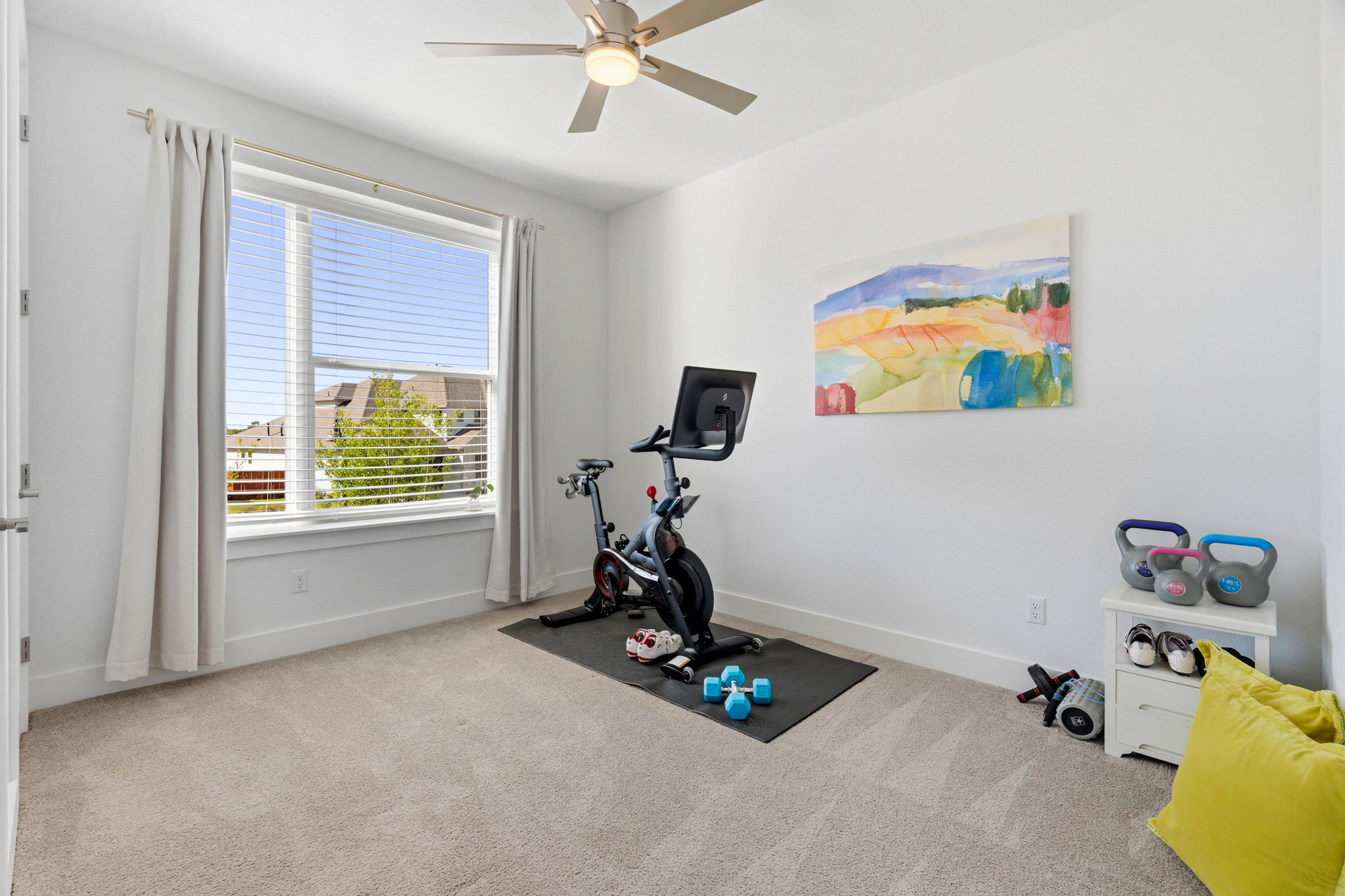 306 Bridge Water Loop Dripping Springs, TX 78620 - Photo 25 of 40 a view of room with gym equipment and a window