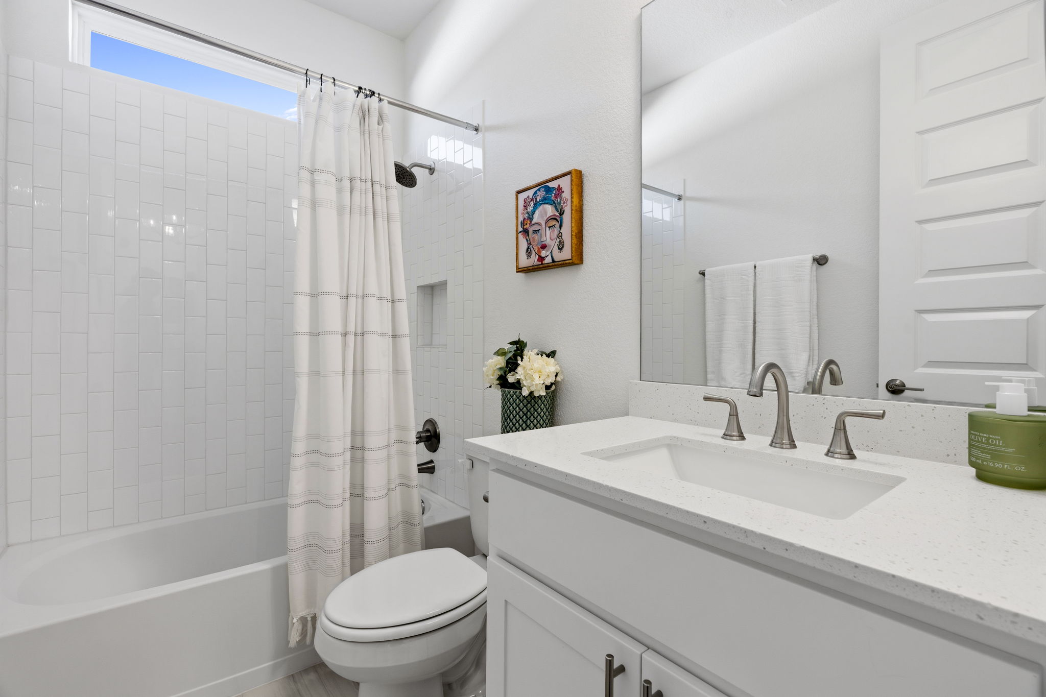 306 Bridge Water Loop Dripping Springs, TX 78620 - Photo 26 of 40 a bathroom with a sink a toilet and shower