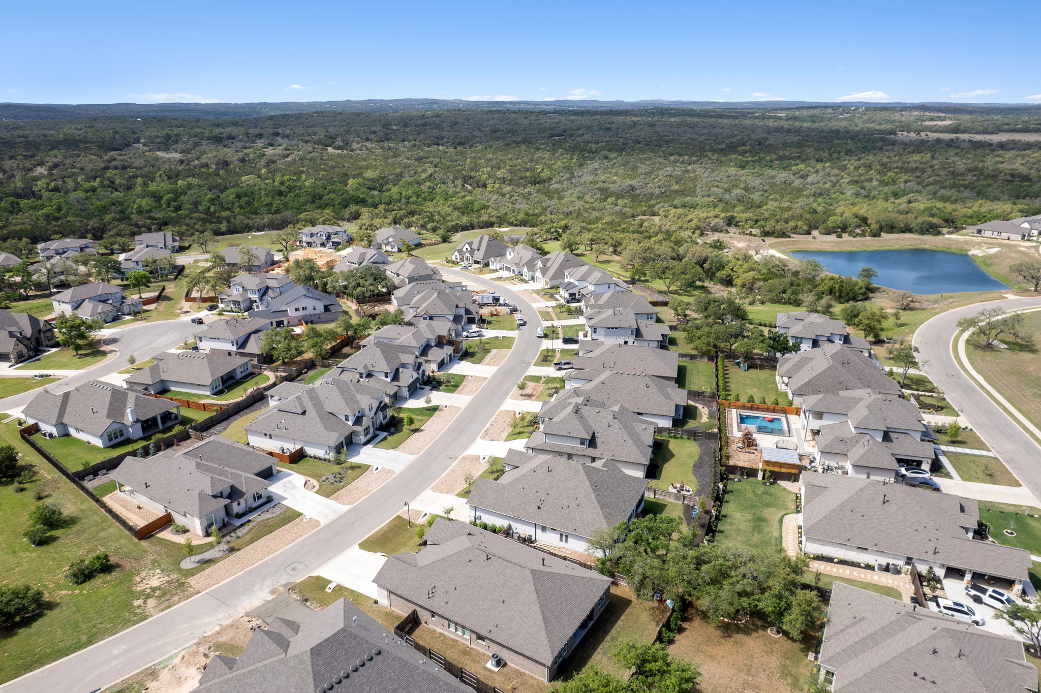 306 Bridge Water Loop Dripping Springs, TX 78620 - Photo 31 of 40 an aerial view of residential building with outdoor space