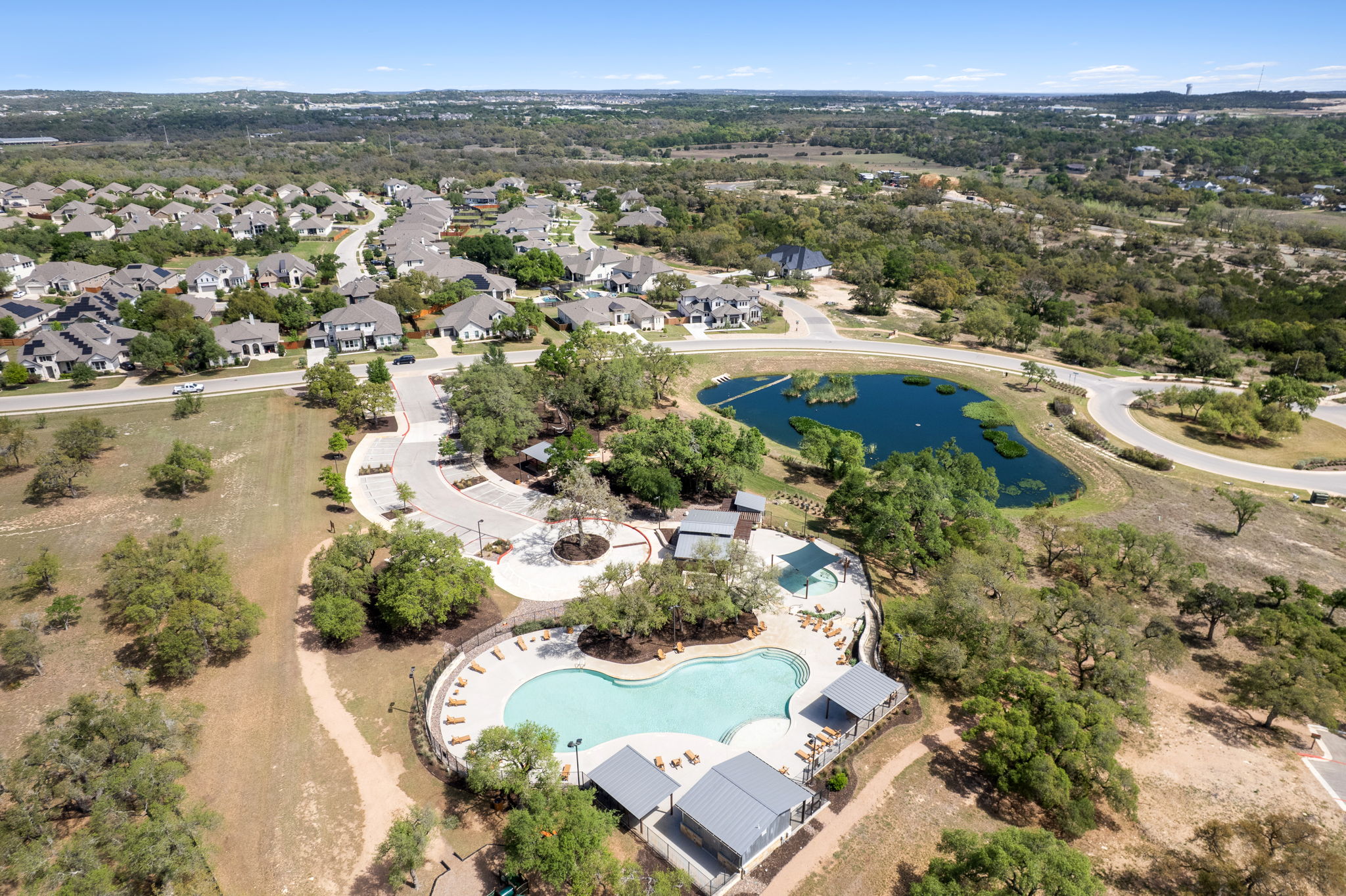 306 Bridge Water Loop Dripping Springs, TX 78620 - Photo 32 of 40 an aerial view of residential houses with outdoor space