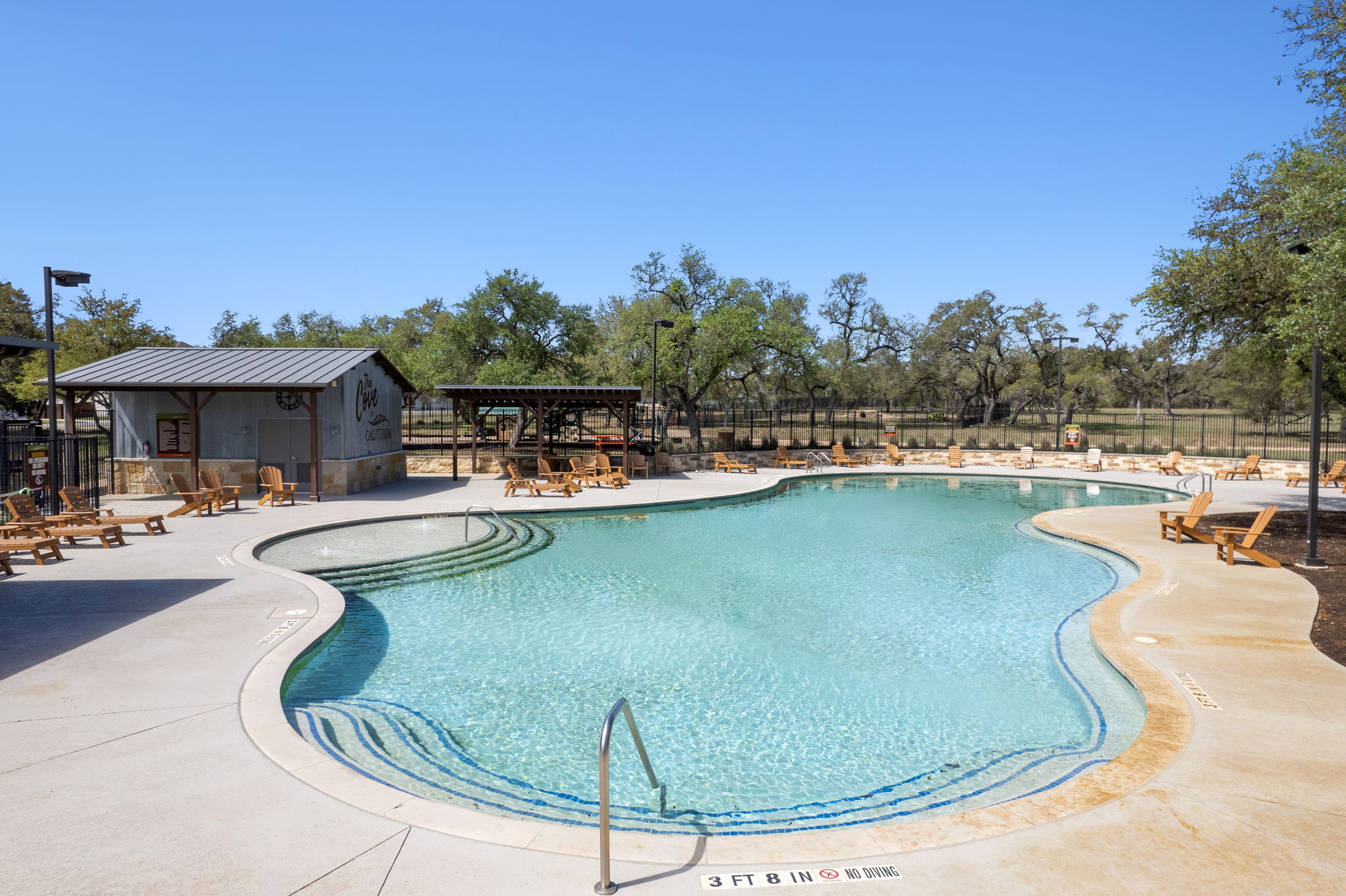 306 Bridge Water Loop Dripping Springs, TX 78620 - Photo 33 of 40 a view of a swimming pool with outdoor seating