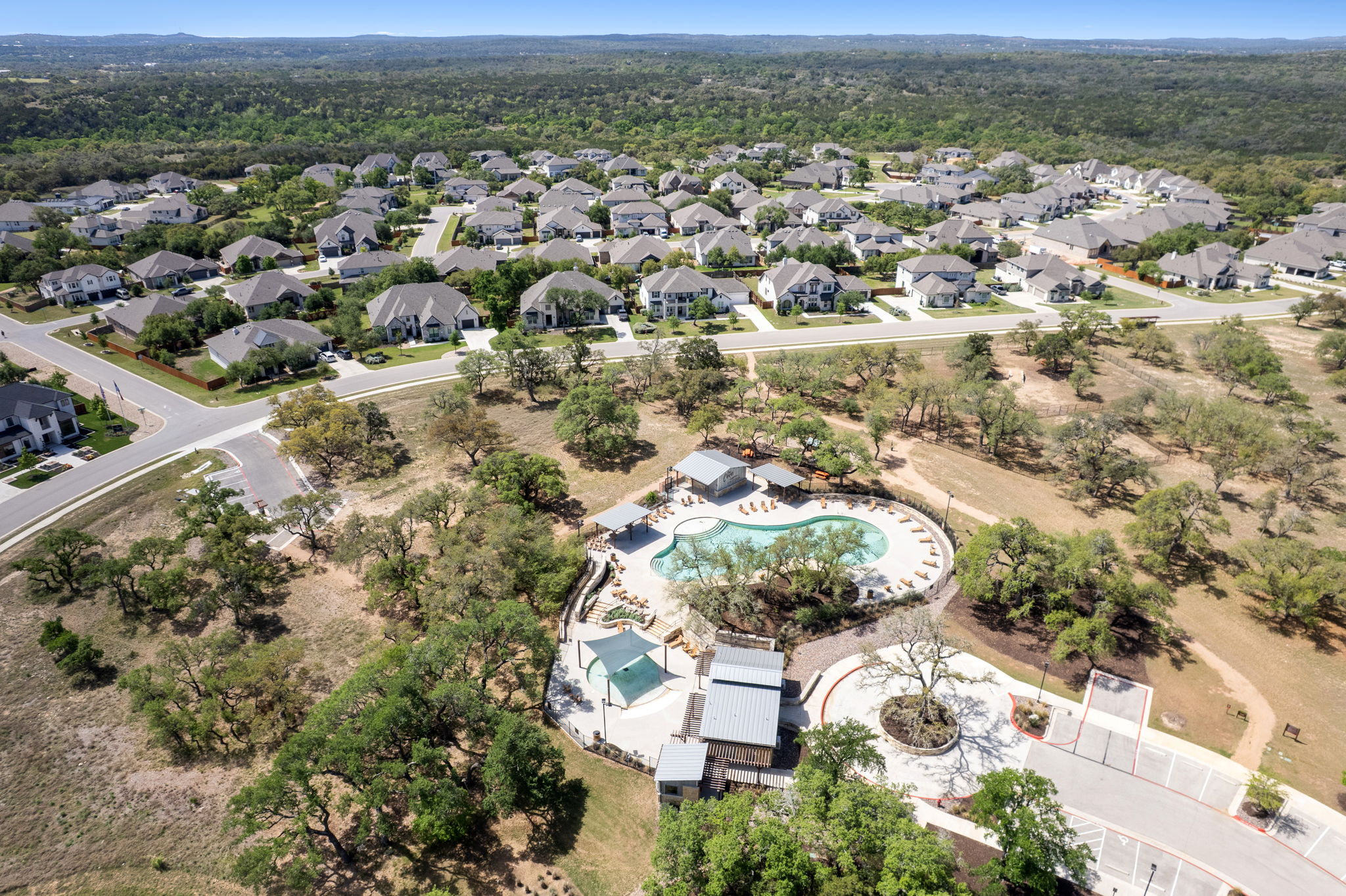 306 Bridge Water Loop Dripping Springs, TX 78620 - Photo 36 of 40 an aerial view of residential houses with outdoor space