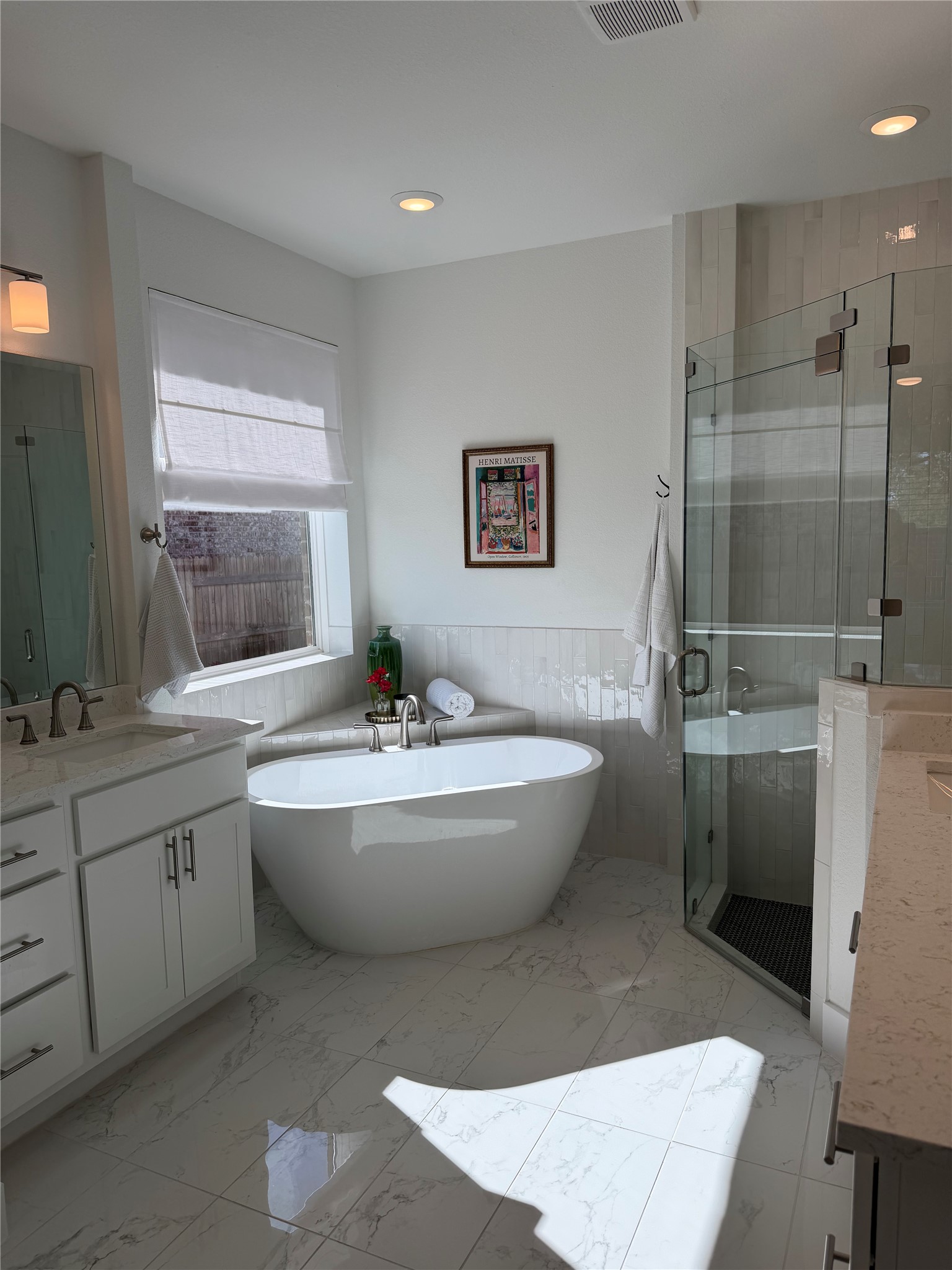306 Bridge Water Loop Dripping Springs, TX 78620 - Photo 4 of 5 Full bath with vanity, a wainscoted wall, a stall shower, a freestanding tub, and tile walls